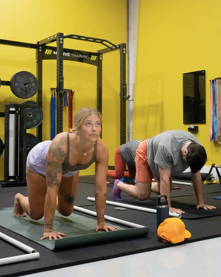 Instructor explaining the science behind KINSTRETCH joint training